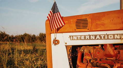 International tractor with flag on the field photo